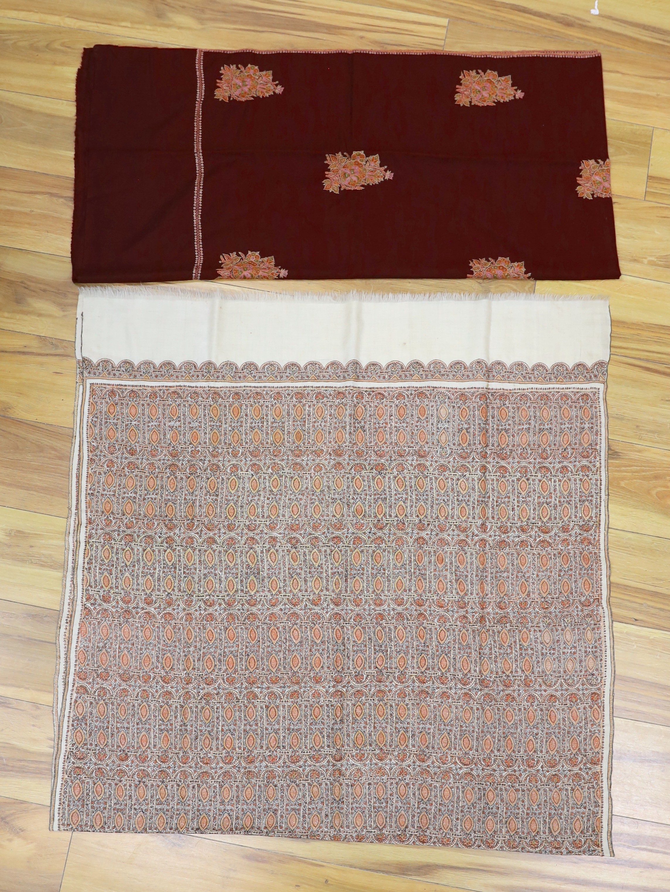 An Indian 20th century pashmina silk embroidered shawl and a cashmere wool shawl with spot motif embroidery